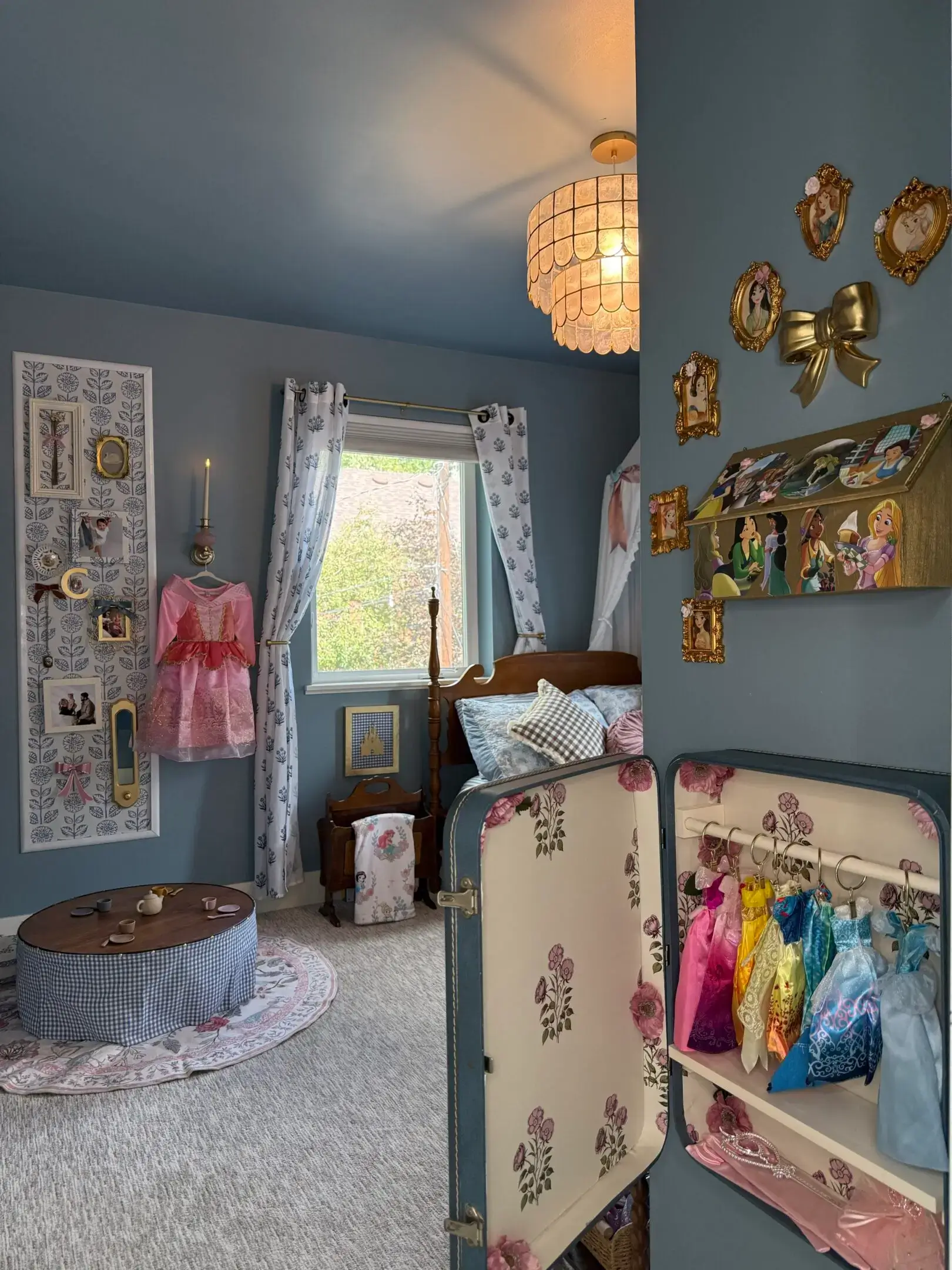 Cozy nursery with a vintage suitcase and plush toys by the window.